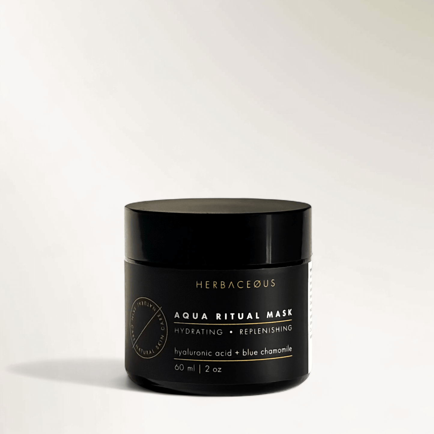 Black jar of Herbaceous Aqua Ritual Mask on a white background