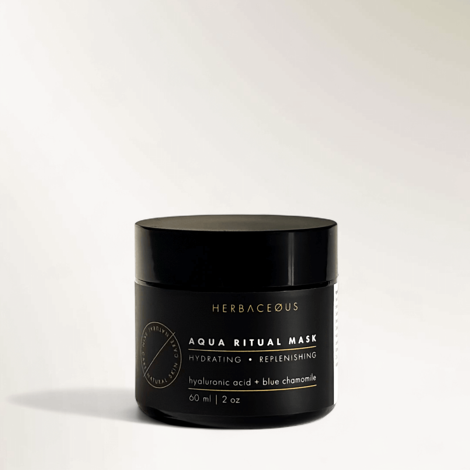 Black jar of Herbaceous Aqua Ritual Mask on a white background