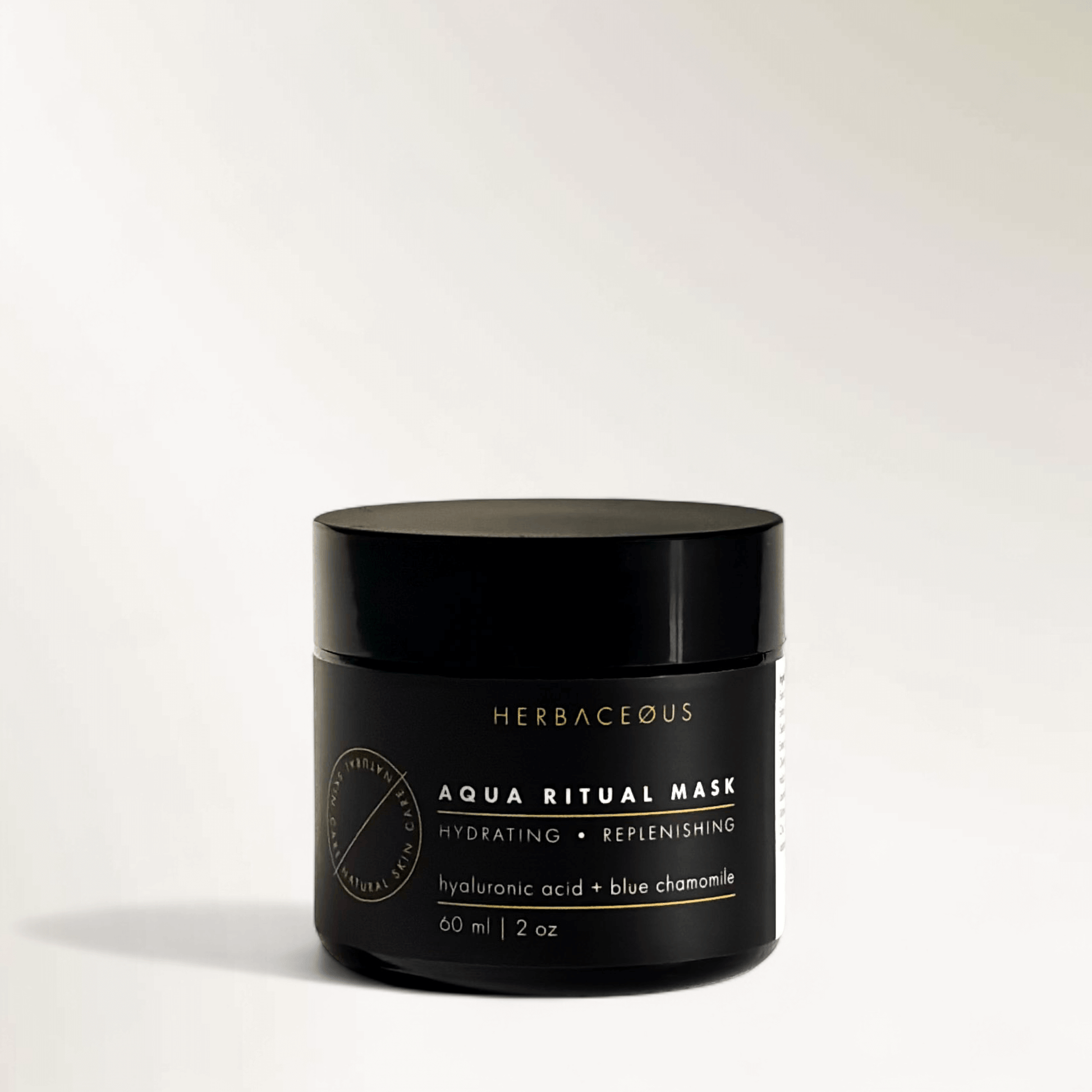 Black jar of Herbaceous Aqua Ritual Mask on a white background