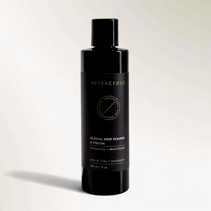 Black bottle of Herbaceous glacial deep cleanse and polish on a light gray background