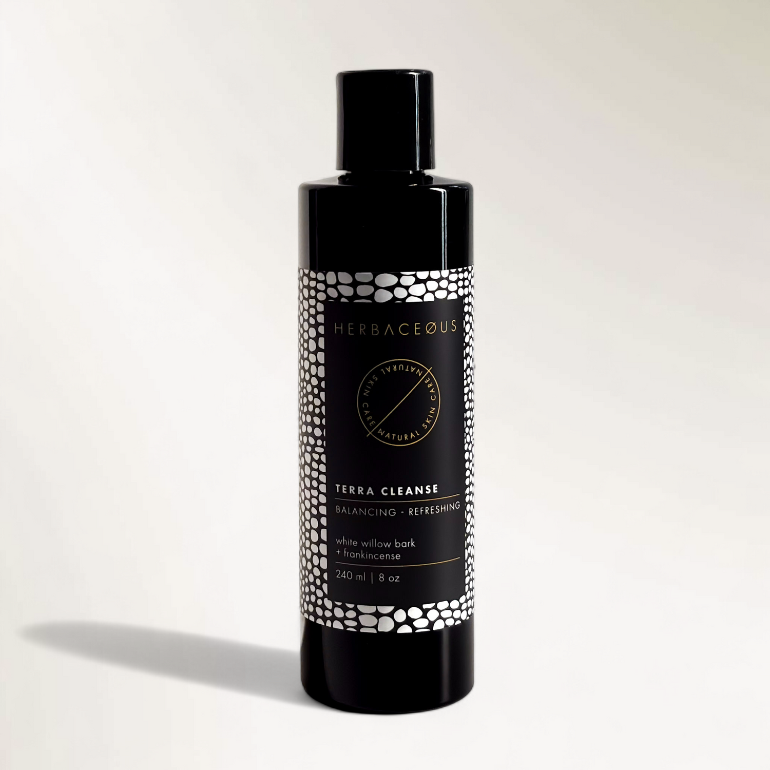 Herbaceous Terra Cleanse bottle on a light gray background