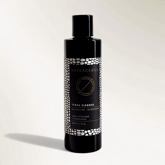 Herbaceous Terra Cleanse bottle on a light gray background