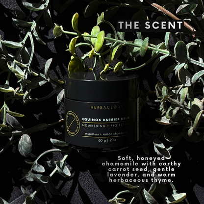Black container of Equinox Barrier Balm surrounded by green leaves with product description text.