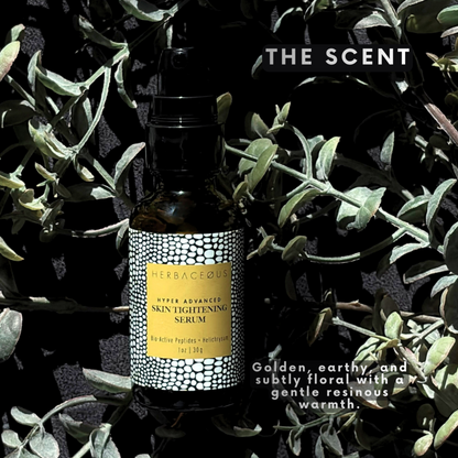 Herbaceous skin tightening serum bottle with label against a dark background with green leaves.